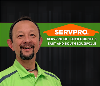 man smiling at the camera in a SERVPRO shirt 
